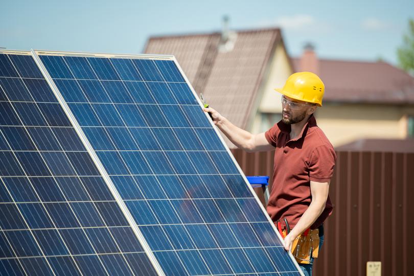 Solar panels being installed on a residential roof in UK