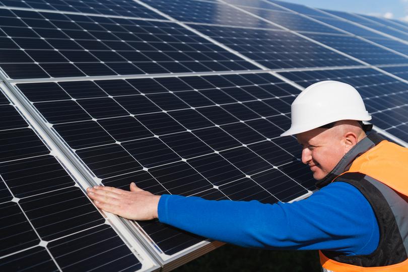 Solar panels being installed on a residential roof in UK